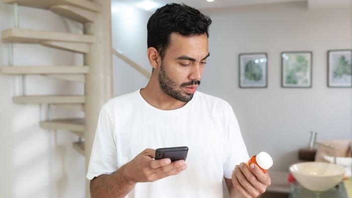 man checking on phone